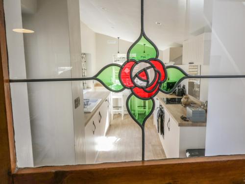 a stained glass window in a kitchen at The Snug in Keighley