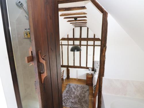 a stairway leading to the second floor of a house at Harbourne Oast in Tenterden