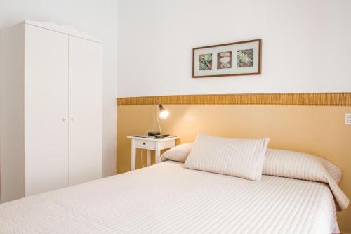 Cama o camas de una habitación en Hostal Jomarijo