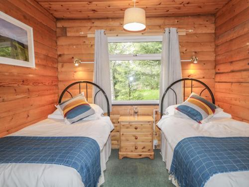 Кровать или кровати в номере Otter Lodge