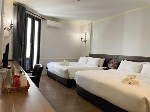 Ein Bett oder Betten in einem Zimmer der Unterkunft The MACEO Hotel
