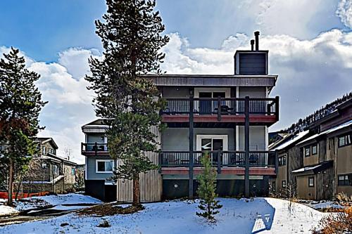 a large house with a balcony in the snow at Quaint Mountain Condo in Frisco