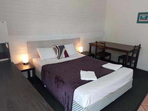 Postel nebo postele na pokoji v ubytování Paradise Motel