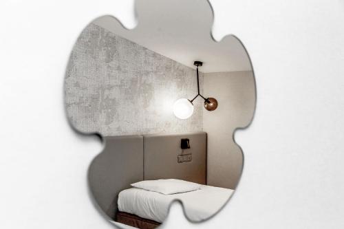 a jigsaw puzzle of a bedroom with a bed at Hôtel Restaurant du Château de la Tour in Béguey