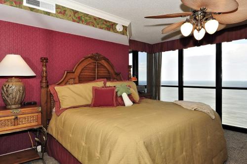 a bedroom with a bed and a ceiling fan at Golden Sands XII in Ocean City