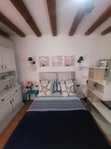 a bedroom with a large bed in a room at Marine Studio on the Beach in Icod de los Vinos