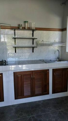 a kitchen with a sink and a counter at Seabreeze Cottage in Ko Chang