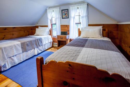 Säng eller sängar i ett rum på Boothbay Lake House