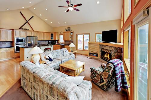 a living room with two couches and a fireplace at Teller Townhomes 106 in Frisco