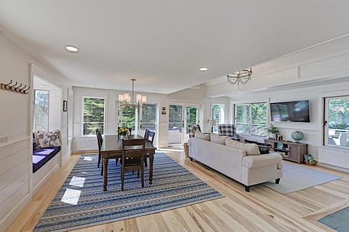 a living room with a couch and a table at Newcastle Lake House in Newcastle