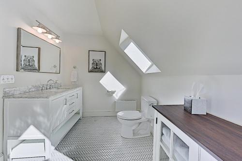 a white bathroom with a sink and a toilet at Newcastle Lake House in Newcastle