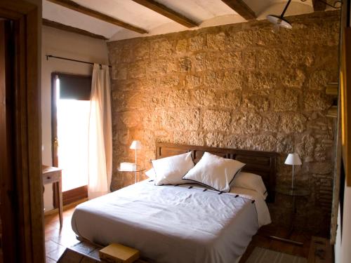 Postel nebo postele na pokoji v ubytování Castillo de Grisel