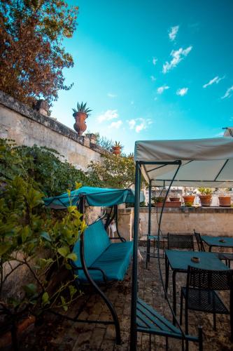 a group of chairs and tables under a tent at Donna Lina in Matera