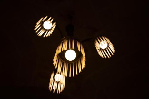 a group of lights hanging from the ceiling at Donna Lina in Matera