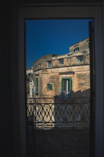 a view of a building from a window at Donna Lina in Matera
