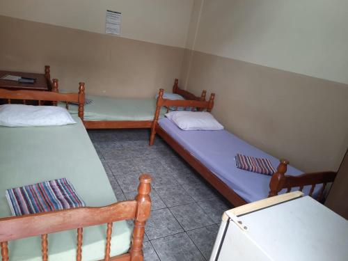 Ένα ή περισσότερα κρεβάτια σε δωμάτιο στο HOTEL TROPICAL