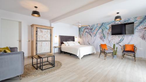 Postel nebo postele na pokoji v ubytování Etti - Paradise Suite El Olivo y el Mar