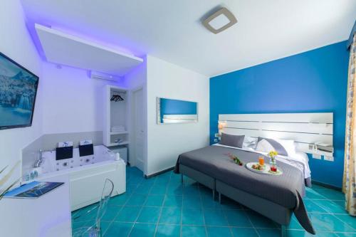 Ένα ή περισσότερα κρεβάτια σε δωμάτιο στο Agave Hotel
