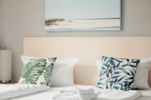 Hotel 'Das Strandhaus'にあるベッド