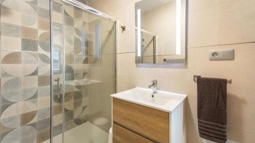 a bathroom with a sink and a shower at Etti-Paradise Suite La Ballena in Pájara
