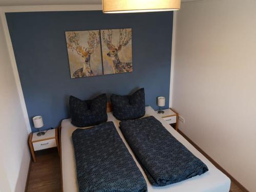 a bedroom with two beds with pillows on them at Ferienwohnung Hofmeier in Hinterzarten