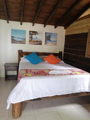 Postel nebo postele na pokoji v ubytování Hotel Nautilos Nuquí