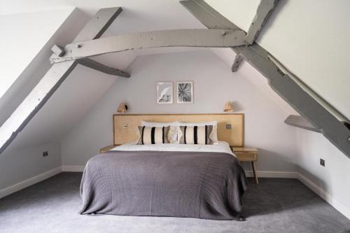 a bedroom with a bed in an attic at The Kingswood Hotel in Sidmouth