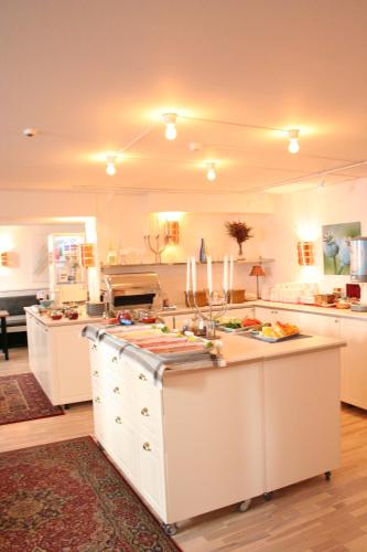 Una cocina o cocineta en Hotel Poseidon