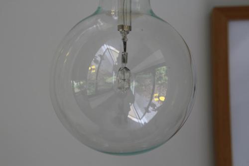 a glass orb hanging on a wall at B&B Les Lits de Nohaipré in Rendeux