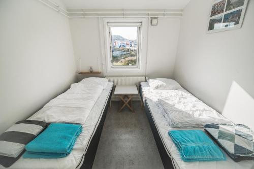 En eller flere senger på et rom på Hope Hostel