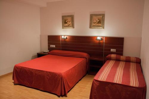 Llit o llits en una habitació de Norte Hotel