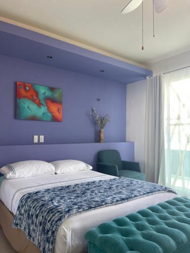 Ένα ή περισσότερα κρεβάτια σε δωμάτιο στο Hotel Villa Escondida Campeche