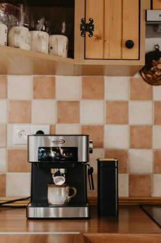 a coffee maker on a counter in a kitchen at Málna Major in Mályinka