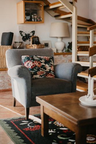 a living room with a couch and a table at Málna Major in Mályinka