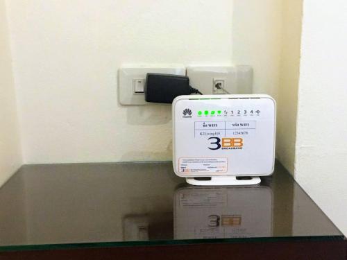 a scale sitting on top of a counter in a room at K2 Living Hotel in Uttaradit