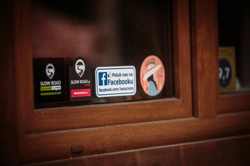 a close up of a door with stickers on it at Łosia Chata in Grzybowce