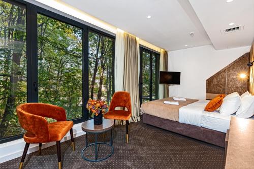 Postel nebo postele na pokoji v ubytování Hotel Ub Aqua Park
