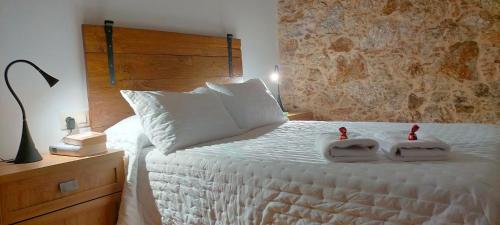 Posteľ alebo postele v izbe v ubytovaní O Labrego de Boimorto