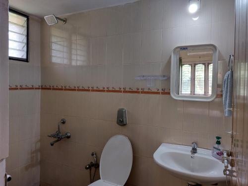Ванна кімната в Tharavad Holiday Home