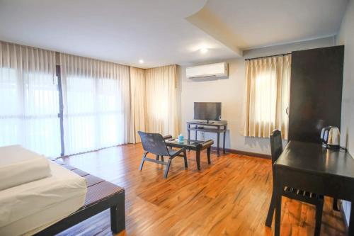 a room with a bedroom with a desk and a bed at Hua Hin Home Hill in Hua Hin