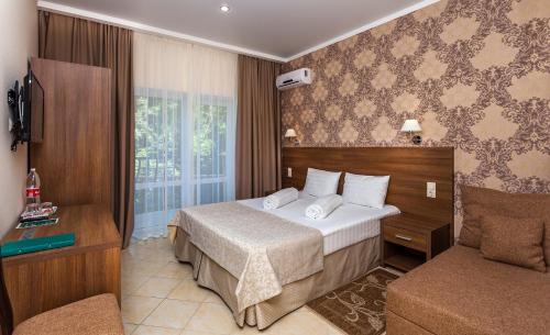 Krevet ili kreveti u jedinici u okviru objekta Kedrovaya Roscha Hotel