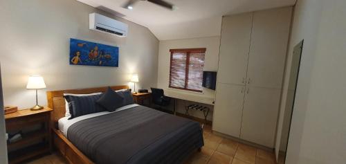 Ένα ή περισσότερα κρεβάτια σε δωμάτιο στο Samson Beach Chalets