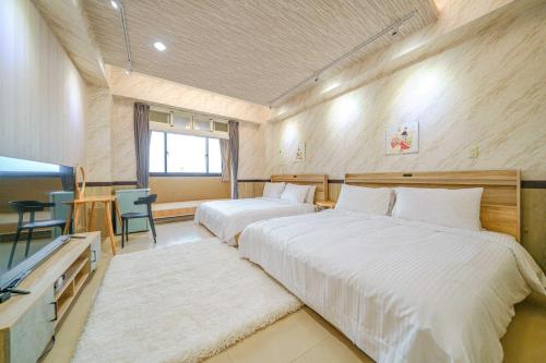 Voodi või voodid majutusasutuse 鼎愛溫泉行館 toas