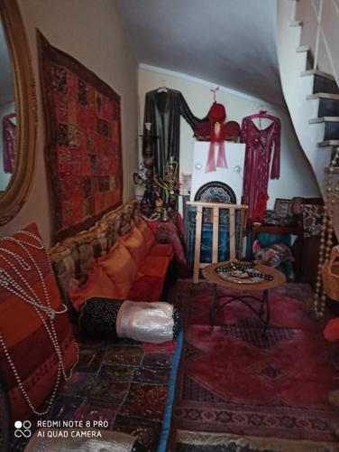 a living room with a couch and a table at Anatoli Hotel in Agia Marina Aegina