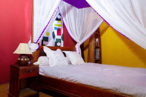 מיטה או מיטות בחדר ב-Bohobé Naboty