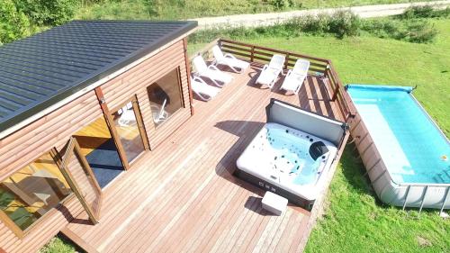 an overhead view of a deck with a swimming pool at Mana Village - Jacuzzi & Sauna in Barłomino