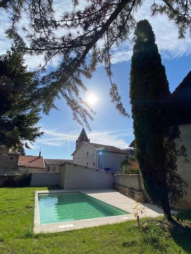 a swimming pool in the yard of a house at MY BOUTIQUE GUESTHOUSE - Fabulous Suites 10 Min A7 - in Anneyron