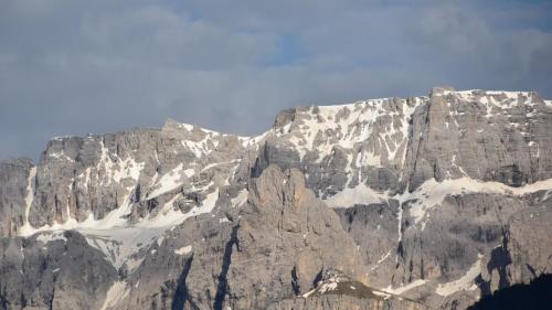 a large mountain with snow on it at Hotel Villa Emilia in Ortisei