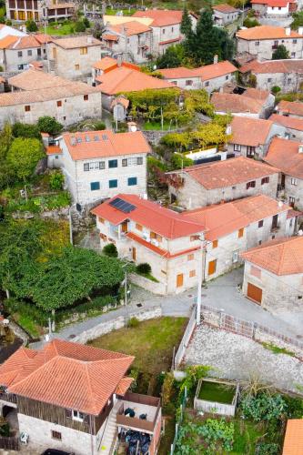 an aerial view of a town with orange roofs at Casa da Fonte Gerês in Campo do Gerês