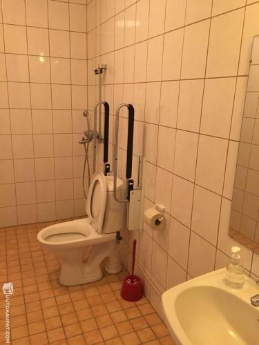 a bathroom with a toilet and a sink at NORDIC LAKES OY/AB in Taivalkoski